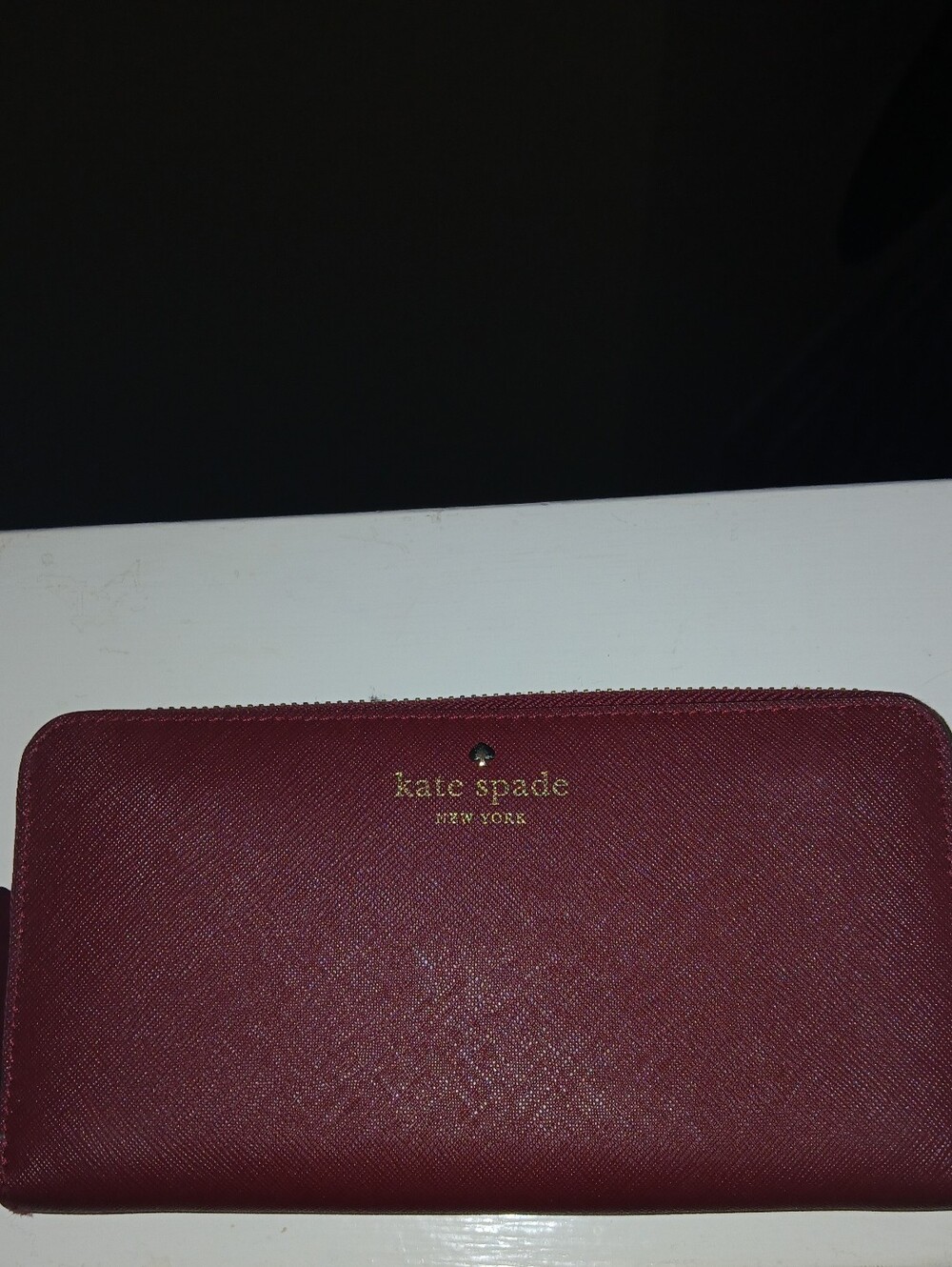 kate spade zip-around wallet in deep red with gold trim